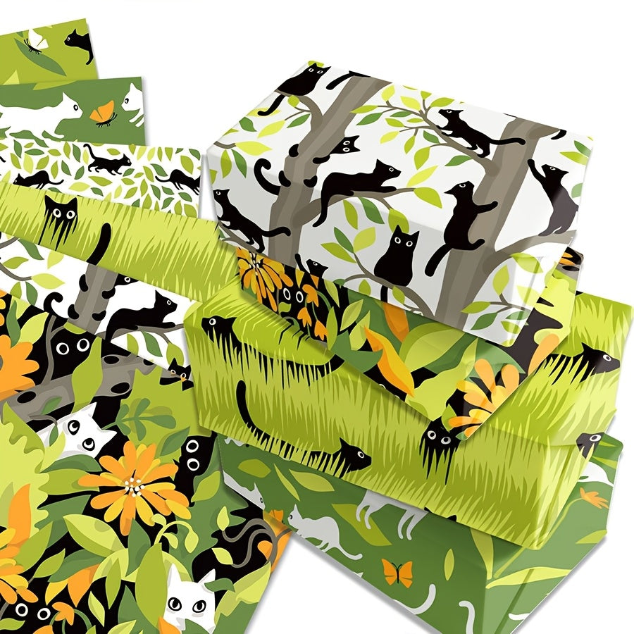 Cadeautjes ingepakt met inpakpapier katten. 12 vellen van 50x70cm, zwart en witte katten in bos, bladeren en gras.
