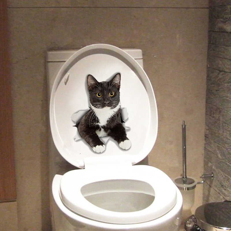 Een Tuxedo kat sticker op een toiletbril. Het lijkt net alsof de kat eruit komt door het 3D effect. Perfect voor op muren, koelkasten en containers.