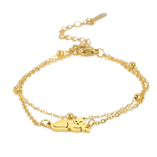 Dubbele armband goudkleurig "Liggende kat". Armband heeft 5 cm verlengstuk.