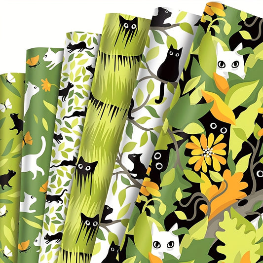 Inpakpapier katten, 12 vellen (70x50 cm), 6 designs met speelse katten in bladeren, bomen en gras. Vellen zijn gevouwen.