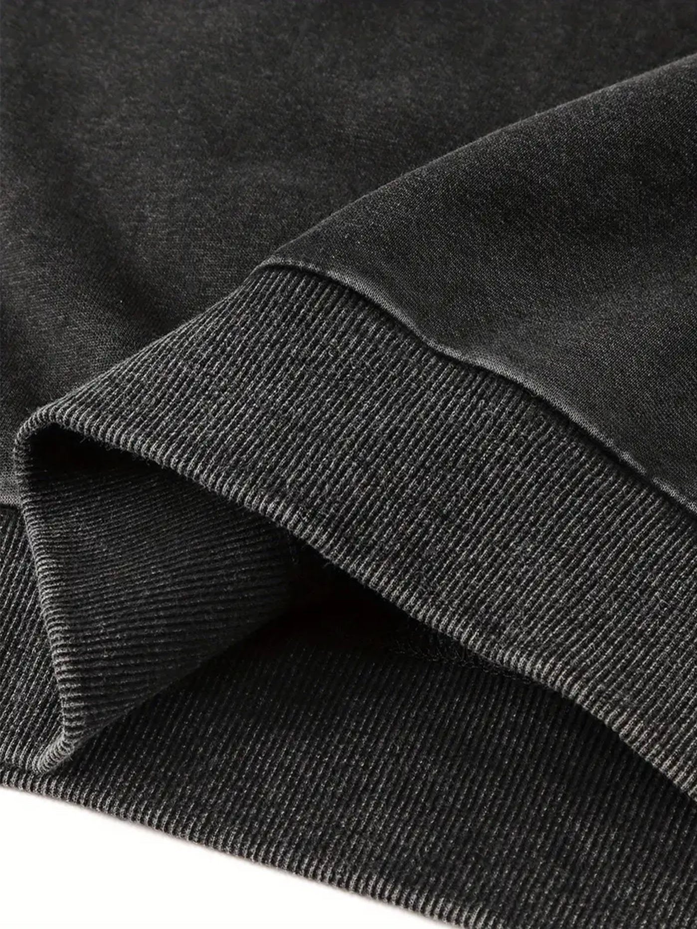 Close-up van de geribbelde boord onderkant van de vintage zwarte kattentrui